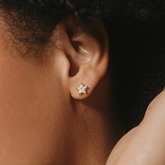 Stella Gold Star Stud Earrings on model